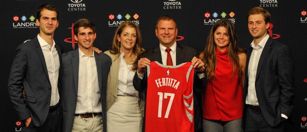Tilman Fertita recieves a Rockets Jersey with his name on it.